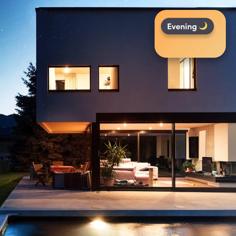 Smart Downlight Retrofit Kit With SuperColor Technology, 800 Lumen, 90 CRI illuminating modern house exterior at dusk