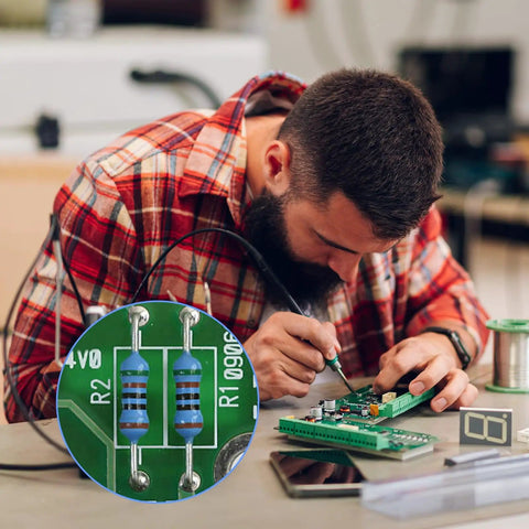 Man using Dope Resistor Kit For Makers And Hobbyists With 400 Pieces And 40 Values From 1 Ohm To 1 Megaohm 0.5W Metal Film Resistors 1% Tolerance Ideal For Electronics Projects DIY Experiments Breadboard Prototyping And Learning on circuit board
