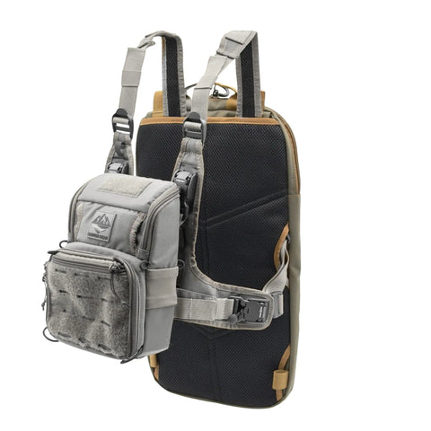 Versatile Tactical Hydration Pack With MOLLE System and Three Wear Modes featuring chest pack attachment shown in grey and black.