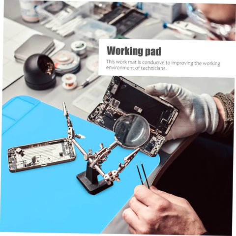 Heavy Duty Silicone Soldering Mat Heat Resistant Workbench Repair Pad For Phones Tablets PC And Watches, blue work surface with magnifying tool.