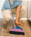 Legit Heavy Duty Pink Broom With Sturdy Steel Handle And Ultra Soft Bristles For Zero Sweat Indoor And Outdoor Floor Cleanup Compact Reusable Dust Brush That Really Cleans in use on hardwood floor.