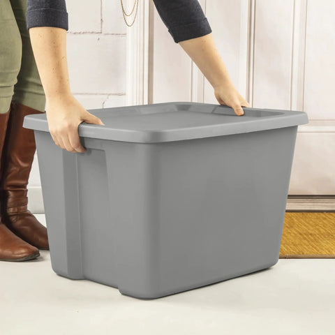 Person lifting a Built Tough Eighteen Gallon Storage Bin With Secure Snap Lid Heavy Duty Stackable Tote For Clutter Control Hella Roomy Gray Plastic Organizer Zero Fuss.