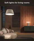 Living room with soft lighting from Smart Home Lighting Starter Kit with Bridge, 1 Smart Button, 3 Soft Warm White A19 LED Bulbs