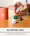 Art Dice Prompts Set Of Nine Wood Dice For Drawing And Painting Inspiration, Color Coded, One Inch Each, Roll To Kickstart Creativity And Bust Artist Block With Easy Read Prompts. Color-coded 1-inch wood art dice in hand and tube