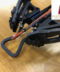 Subatomic Hanger Guard Stirrup For Crossbows Fits R9 R10 R10X R15 R20 R29 R29X LR attached to crossbow on wooden table