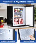 Compact Upright Freezer Featuring Tunable Thermostat And Snap Out Shelves with adjustable shelves, 2.1 cu ft, black finish, filled with food.