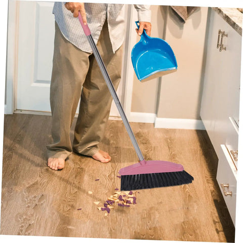 Heavy Duty Pink Broom With Extended Handle Sweeps Indoors And Outdoors Straight Up Tough On Grime Durable Steel Bristles clearing wood floor mess.