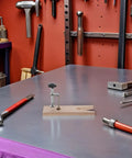 Two Sets Professional V Slot Bench Clamps For Woodworking And Metal Projects With Heavy Duty Installation Tools on a workshop table.