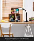 2 In 1 LED Floor And Desk Lamp With Adjustable Height And Gooseneck, lamp illuminating a craft table with yarn and cactus.