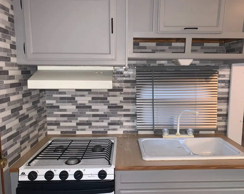 5 Sheet Peel And Stick Backsplash Tiles In Grey Marble Look 12 By 12 Inch 3D Wall Panels in kitchen, behind stove and sink