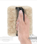 Hand holding USA-made Faux Painting Starter Toolkit For Beginners Full Sized 9.75 By 5 Inch Set with sheepskin pad tool.
