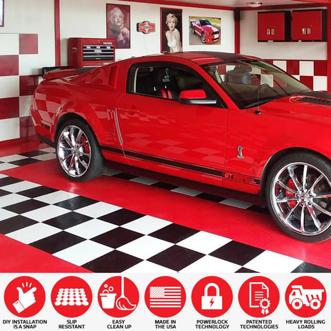 Red car parked on Interlocking Diamond Plate Garage Floor Tiles for a Tough, Easy Clean Garage Makeover, Heavy Duty Copolymer Modular Tiles.