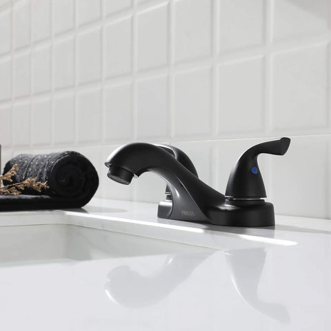 Side view of Two Handle Matte Black Bathroom Sink Faucet With Metal Drain Assembly And Supply Hose Lead Free cUPC NSF 61 Certified 4 Inch Centerset 3 Hole Mount Includes Push Pop Up Drain No Fuss Easy Install in a white tiled bathroom setting.