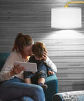 LED Floor Lamp With 3 Color Temperatures And Foot Switch, Tall Gold Standing Lamp For Living Room, Bedroom, Study Or Office, 9W E26 Bulb Included, 810LM Brightness, Modern Design, Easy To Use lighting up a cozy room scene with family.