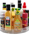Clear Acrylic 11 Inch Lazy Susan Organizer With A Super Smooth 360 Spin That Makes Taming Kitchen Clutter An Absolute Game Changer For Pantries And Fridge Storage, displaying various sauces and spices.