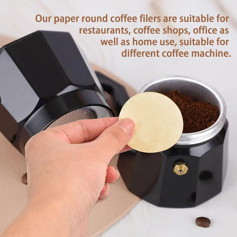 Hand holding Round 56mm Disposable Coffee Filter Papers 200 Pack For Moka Pots And Drip Makers Unbleached Natural Paper