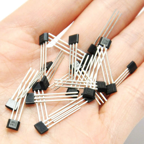 Top Tier Hall Effect Sensor Magnetic Detector Pack Of Twenty For Arduino Projects Offering Four Point Five To Twenty Four Volt Operation And Reverse Polarity Shield Delivers A Kickass Setup For Street Rod Wiring And Smooth Electronic Switching Control in hand, showing individual sensors.