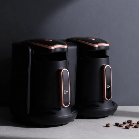 Electric Turkish Coffee Maker With Dual Pot Design 1200W 500ml 2 Cup Brew System For Fast Brew And Anti Scald Handle Built For Home Or Travel Two Flavor Vibes, shown with two black and copper pots on a countertop.