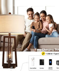 All In One 26 Inch Set Of 2 Farmhouse Table Lamps With USB And USB C Ports shown with family charging devices