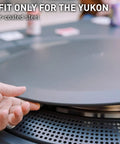 Hand placing Surround Surface For Yukon Fire Pit Lid Durable Cold Rolled Steel Shield Doubles As Backyard Tabletop, 34.5 inch.