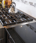 Stainless Steel Stove Gap Covers 2 Pack for Kitchen Counter Gaps, installed on stove, showing clean and seamless gap coverage.