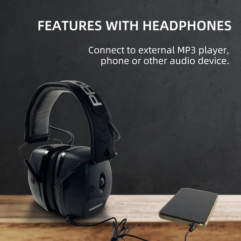 Electronic Shooting Ear Protection Muffs With 30 dB NRR and 0.01s Reaction Time connected to audio device on table