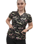 Snag This Very Fresh Women's V Neck Scrub Top For Medical And Nursing Uniforms Graphic Splatter Print Performance Fit Work Wear For Healthcare Pros, shown on a model with pockets.