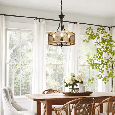 Dining room with Four Light Industrial Pendant Lighting With Black Square Frame Rustic Farmhouse Chandelier For Dining Room And Kitchen Island Adjustable Height E26 Bulbs Not Included hanging above wooden table.