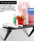 Kick Off Your Desk Upgrade With This Super Solid Black Tv Top Shelf Bracket 2 Pack Monitor Riser Stand For Gaming Setups Gonna Look Dead Legit Today, featuring a compact shelf with remote and decorative plants.