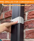 Installing Downspout Gutter Pipe Clip Hidden Bracket 3x4 White Set Of 2 on brick wall with screwdriver