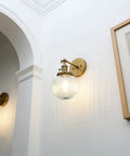 Vintage Industrial Wall Sconce Lighting Fixture With Five Point Nine Inch Round Clear Ribbed Glass Globe Antique Brass Gold Finish