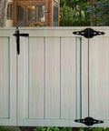 Outdoor wooden fence featuring black hinges from 8 Inch Heavy Duty Gate Hinges For Wood Gates And Fences Black Six Pack With Screws And Mounting Hardware.