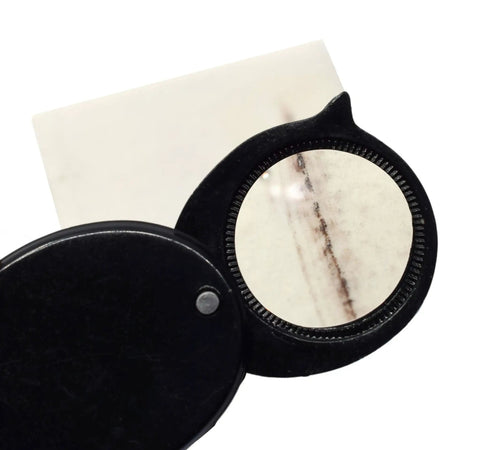 Retractable hand lens from Rock And Mineral Identification Kit With 7 Tools for Quick Rock And Mineral Testing and streak plate