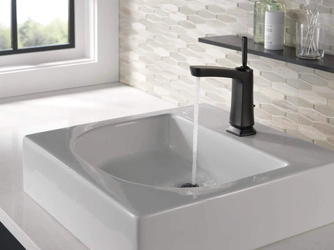 Vesna Single Hole Bathroom Faucet With Single Handle Chrome Finish on a white sink with water flowing into the basin