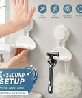 Hassle Free Heavy Duty Suction Cup Razor Holders For Bathroom Sink Organizer With Super Strong No Drill Grip Towel And Loofah Hooks Clutter Free Kitchen And Shower Storage Rack 2 Pack mounted on a wall with a razor and loofah.