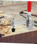Two Pack Quick Release Toggle Clamps For Welding And Woodworking Iron Fixed Holding Clamps with red grip on workbench