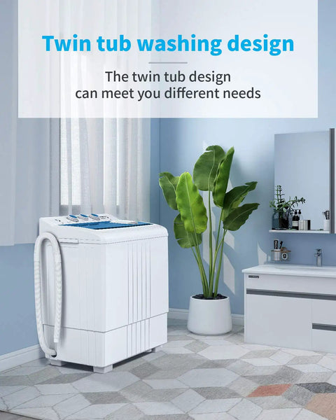 Compact Twin Tub Portable Mini Washer With Built In Drain Pump in a stylish home setting with plants and cabinets.