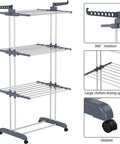 Top Shelf Oversized Four Tier Clothes Drying Rack With A Built Tough Foldable Frame Plus Side Wings For Hanging Laundry Towels Shoes And Quilts Roomy Air Drying Setup with three tiers and locking wheels.