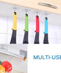 Tough As Nails Adhesive Wall Hooks Heavy Duty Sticky Hangers For Kitchen Living Room Bedroom And Dorm Skip The Drill Stainless Steel hooks holding colorful kitchen utensils.