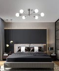Bedroom with Six Light Sputnik Ceiling Light Fixture In Brushed Nickel, Semi Flush Mount, Mid Century Modern Chandelier above bed.