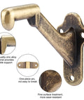 Rock Solid Handrail Stair Brackets For Staircases Heavy Duty Zinc Alloy Railing Supports With Screws Antique Brass Finish. Close-up of a wall-mounted bracket.