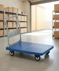Heavy Duty Folding Transport Cart With Aluminum Handle And Rugged Deck For Easy Box Hauls In Warehouses Labs And Classrooms Four Wheel Push Cart For Daily Use And Reliable Smooth Mobility, blue deck in warehouse
