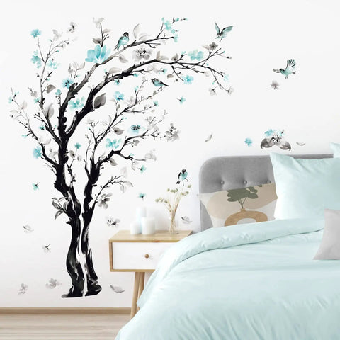 Epic Watercolor Tree Wall Decals With Blue Flower Branches Easy Peel And Stick Waterproof And Removable Perfect For Living Room Bedroom Or Kitchen Decor Giant Size Options 63 Inch Or 48 Inch applied above a bed with gray headboard and mint bedding.