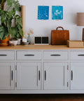 Modern kitchen with white cabinets featuring 30 Pack 3 Inch Matte Black Cabinet Handles for Cabinets and Drawers, Kitchen Hardware Pulls.