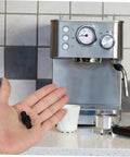 Hand holding Steam Wand Insulation Sleeve And Rubber Cover For Coffee Makers, Replacement Shield For Steam Nozzle.