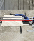 24 Inch Manual Tile Cutter With Tungsten Alloy Wheel And Guided Rail for butter smooth ceramic porcelain cuts on a marble surface.