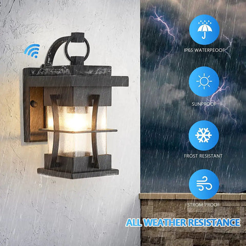 Ultra Durable Dusk To Dawn Outdoor Wall Light In Black Finish With Seeded Glass Shade IP65 Waterproof Exterior Wall Mount Fixture illuminated in rain