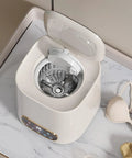 Portable Fully Automatic Washing Machine With LCD Touchscreen Auto Cycle One Click Operation No Sweat Cleanup For Dorms Apartments And RV Travel 9L Compact Washer with open lid and silver drum, on marble surface.