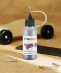 Derby Car Pinewood Weights Kit With 3 Oz Stick On Flexible Weights And Half Ounce Graphite Lubricant bottle on table