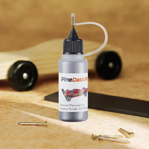 Derby Car Pinewood Weights Kit With 3 Oz Stick On Flexible Weights And Half Ounce Graphite Lubricant bottle on table